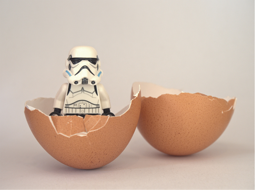 lego storm trooper popping out of a cracked egg shell